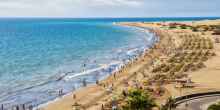 English beach on the island of Gran Canaria in Maspalomas dunes beside